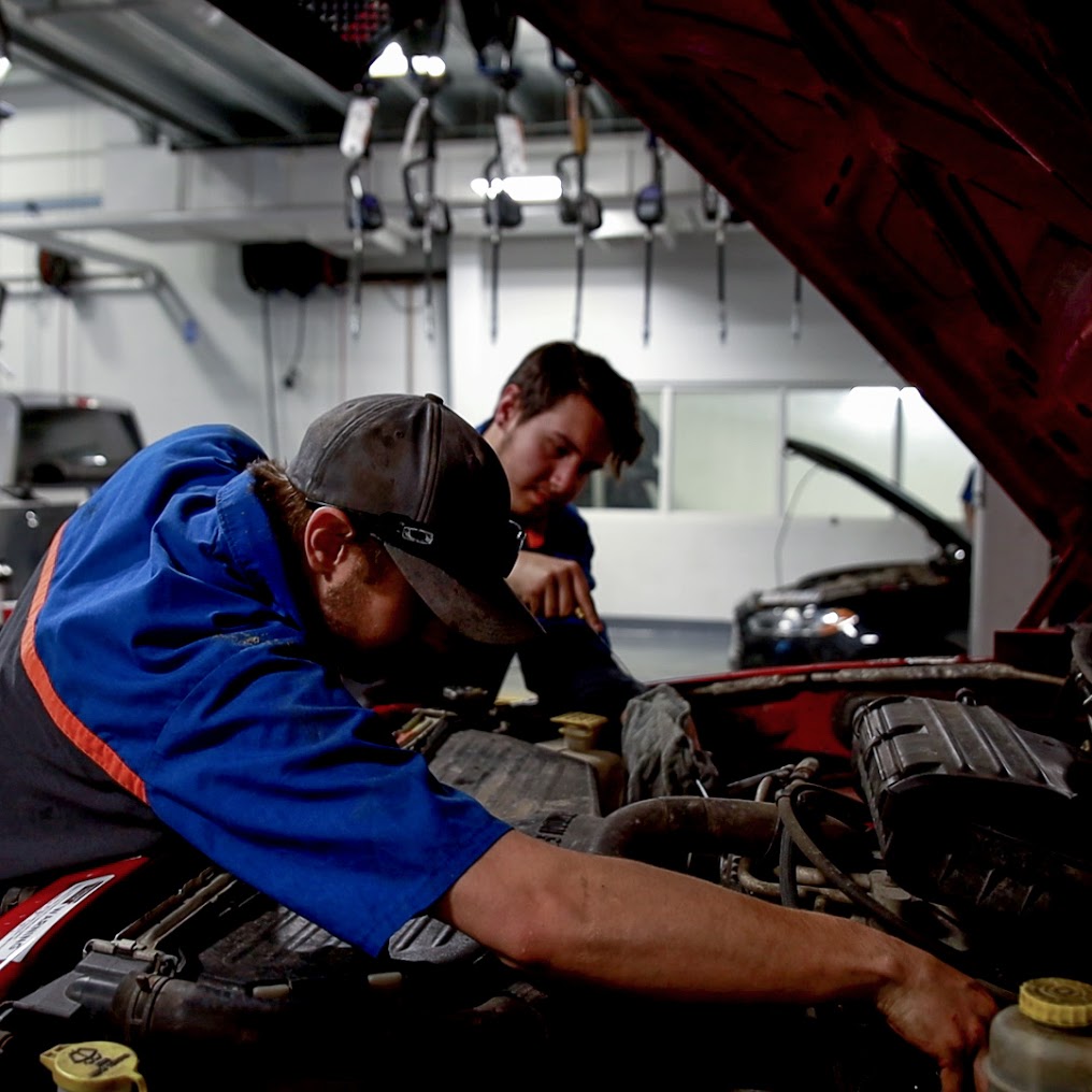 Technician checking the engine after an oil change