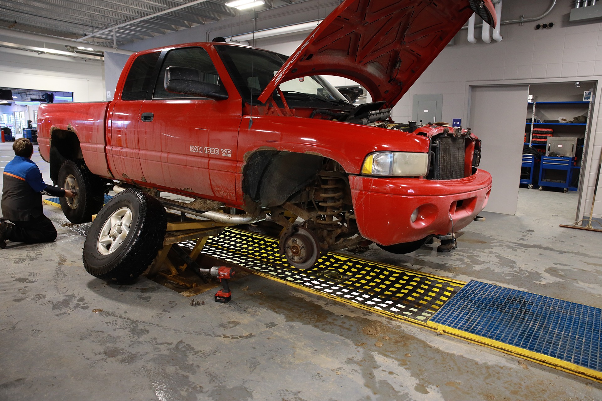 Technician servicing a vehicle